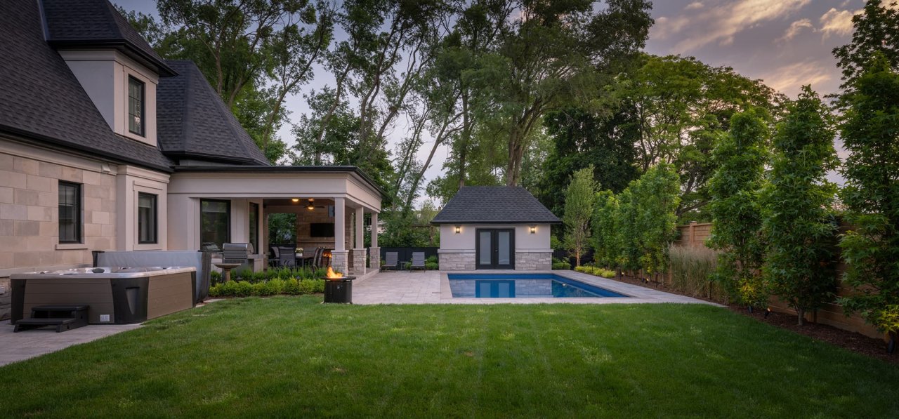 Beautiful backyard landscape with pool and hot tub.